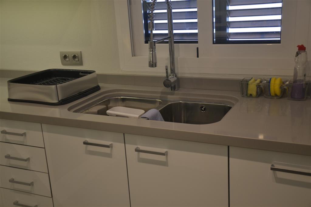 New kitchen in Glossy White and stainless handles